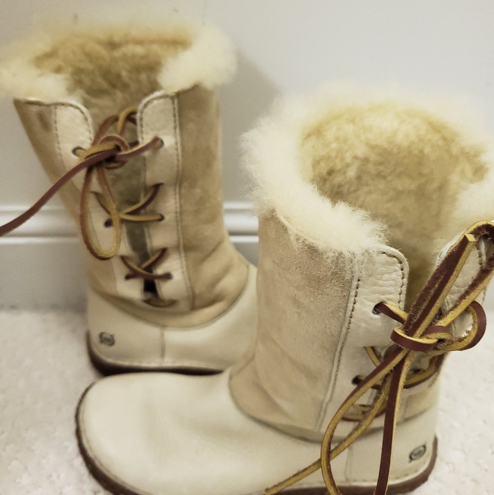 Born mid calf side lace up boots.  Shearling lined